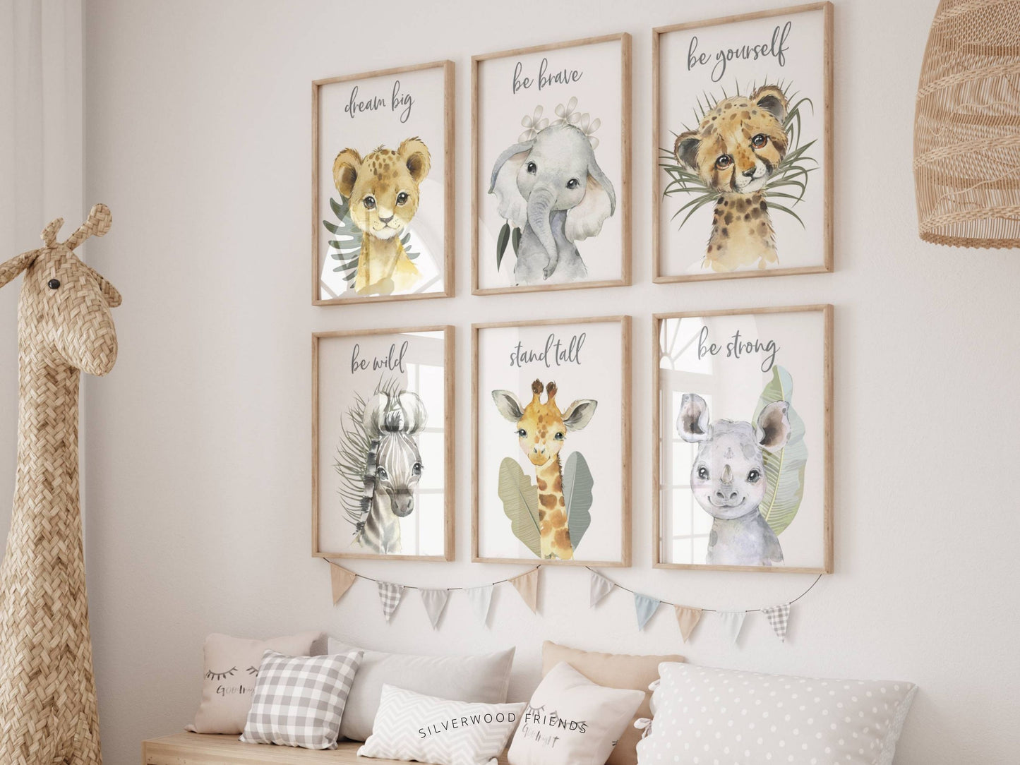 Our Boho Safari Animal Prints with baby safari animals lion, elephant, leopard, zebra, giraffe and rhino is set on a white background with tropical jungle leaves and is perfect for your jungle nursery decor or as a safari baby shower gi