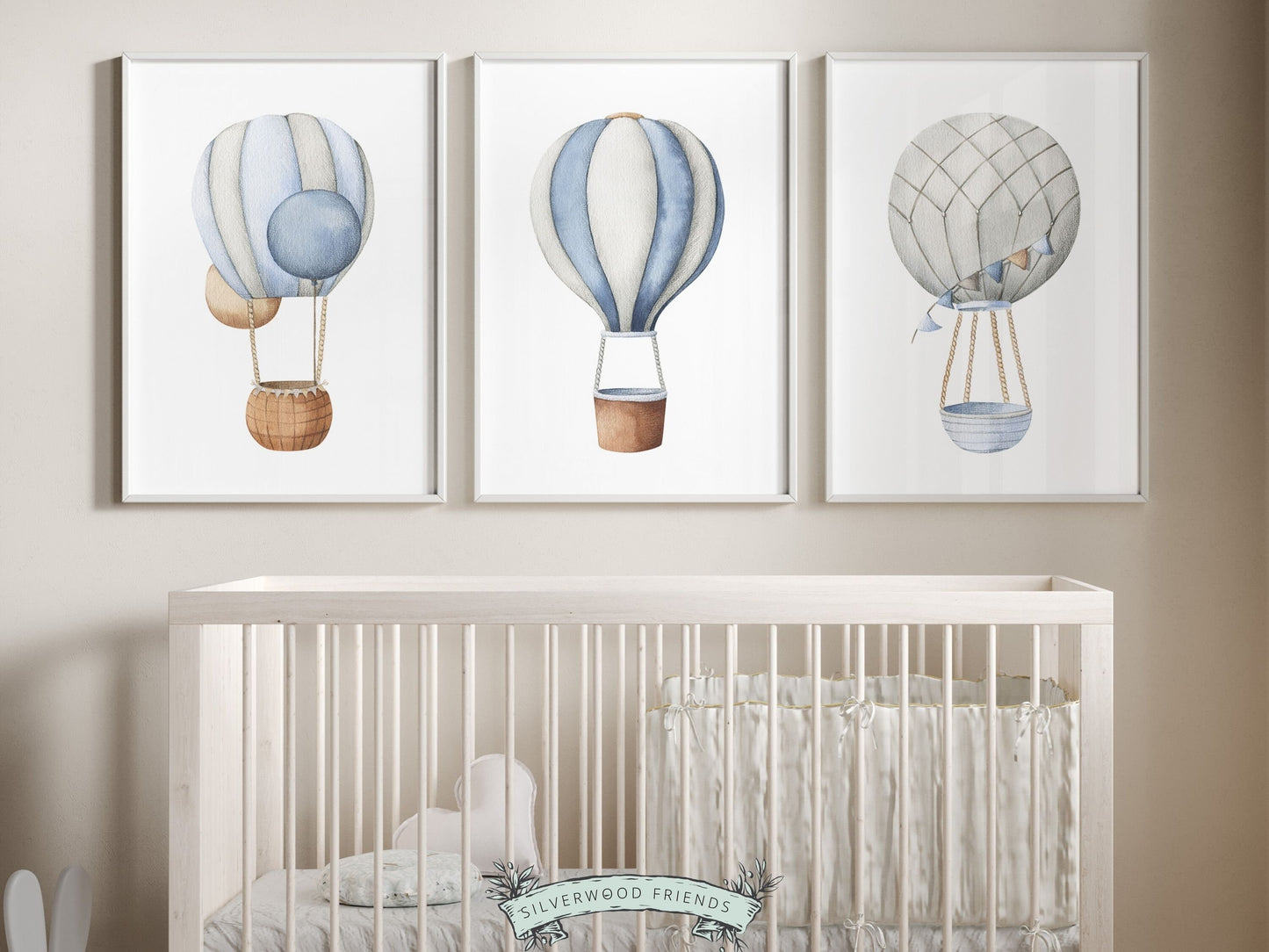 Transform your nursery into a serene haven with our charming Hot Air Balloon Nursery Prints showcasing blue and grey watercolor hot air balloons. Perfect for your little ones transport themed nursery or as a delightful baby shower gift to cherish.
