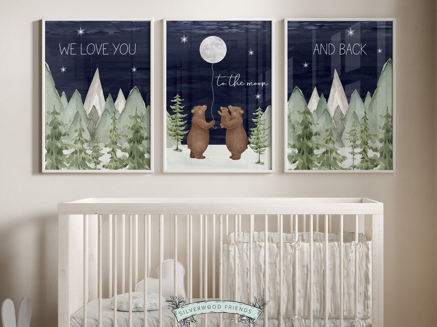Set of 3 Bear Nursery Prints featuring a family of bears holding the moon under a starry night sky surrounded by mountain and woodland forest landscape and quote We love you to the moon and back. For your woodland nursery and as a baby shower gift.