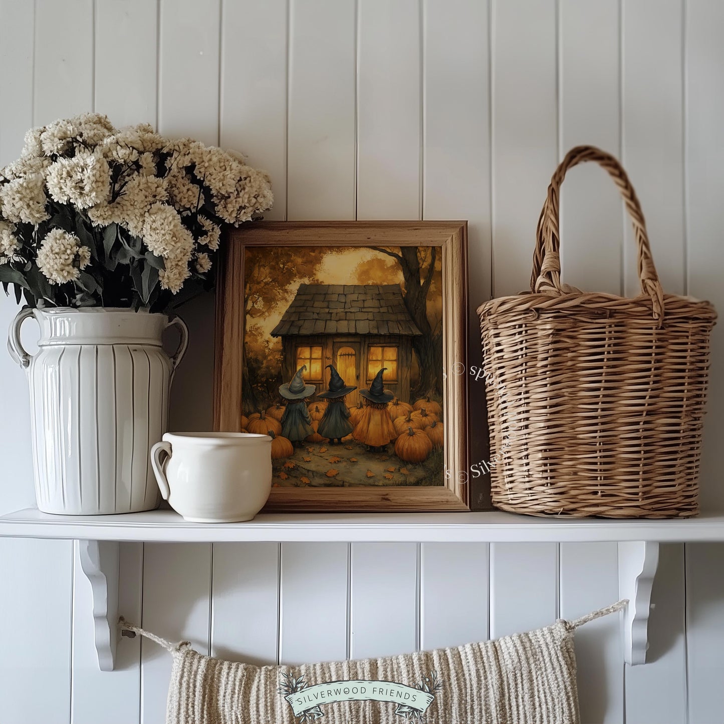 Moody fall artwork featuring cloaked witches and rustic dwelling — soft vintage watercolor with cozy spooky ambiance