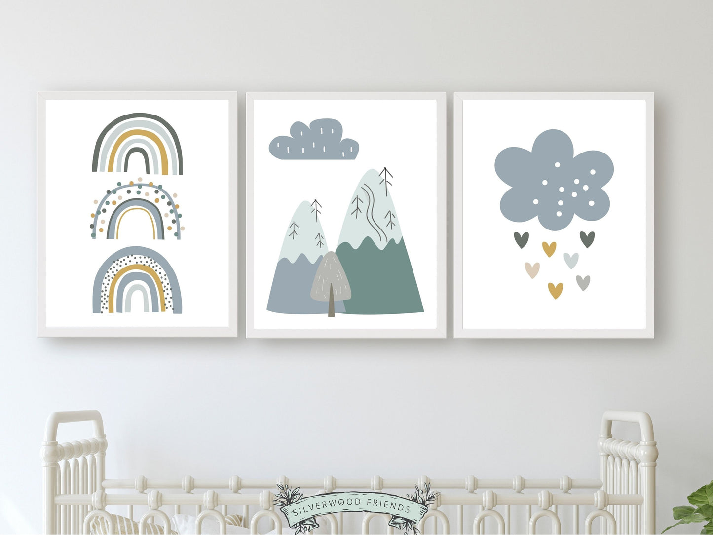 Our Set of 3 Blue Boho Mountain Nursery Prints, featuring Nordic mountains, rainbows and love hearts in tranquil blue and green tones will create a dreamy atmosphere in your little one's nursery.