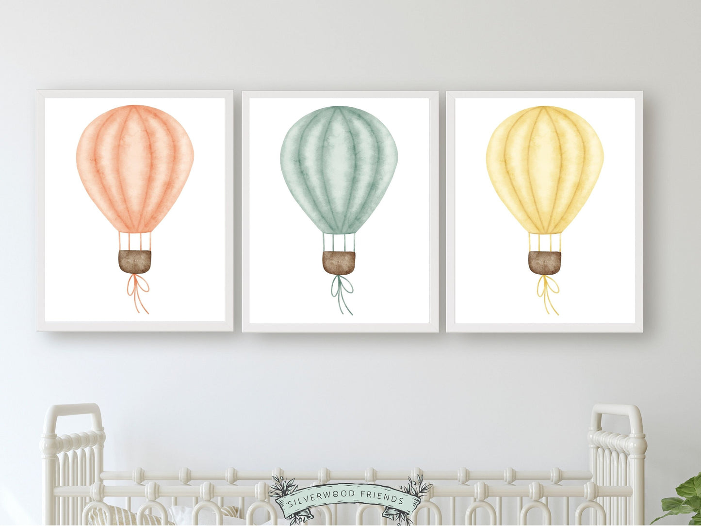 Set of 3 Hot Air Balloon Nursery Prints. Featuring charming watercolour balloons in blue, pink, and yellow, this delightful artwork creates a calm and cozy atmosphere, making it an ideal addition to your little ones space or a perfect baby shower gift.