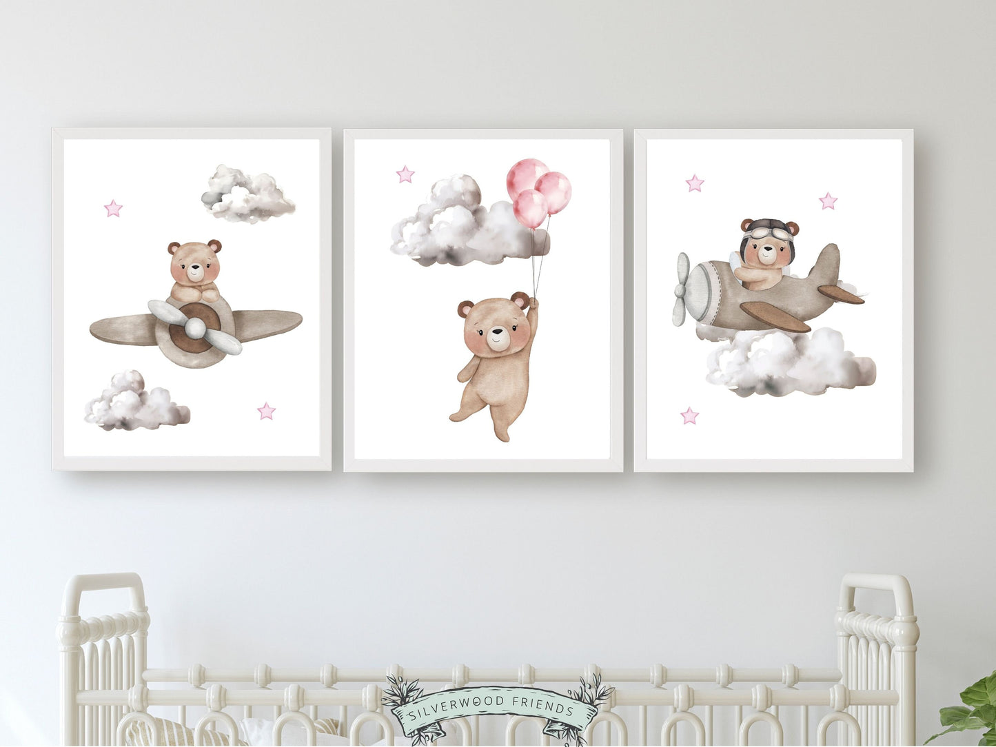 Set of 3 Baby Girls Teddy Bear Nursery Prints featuring watercolour teddy bears souring through the sky with balloons and airplanes in a neutral pale pink and beige colour scheme.