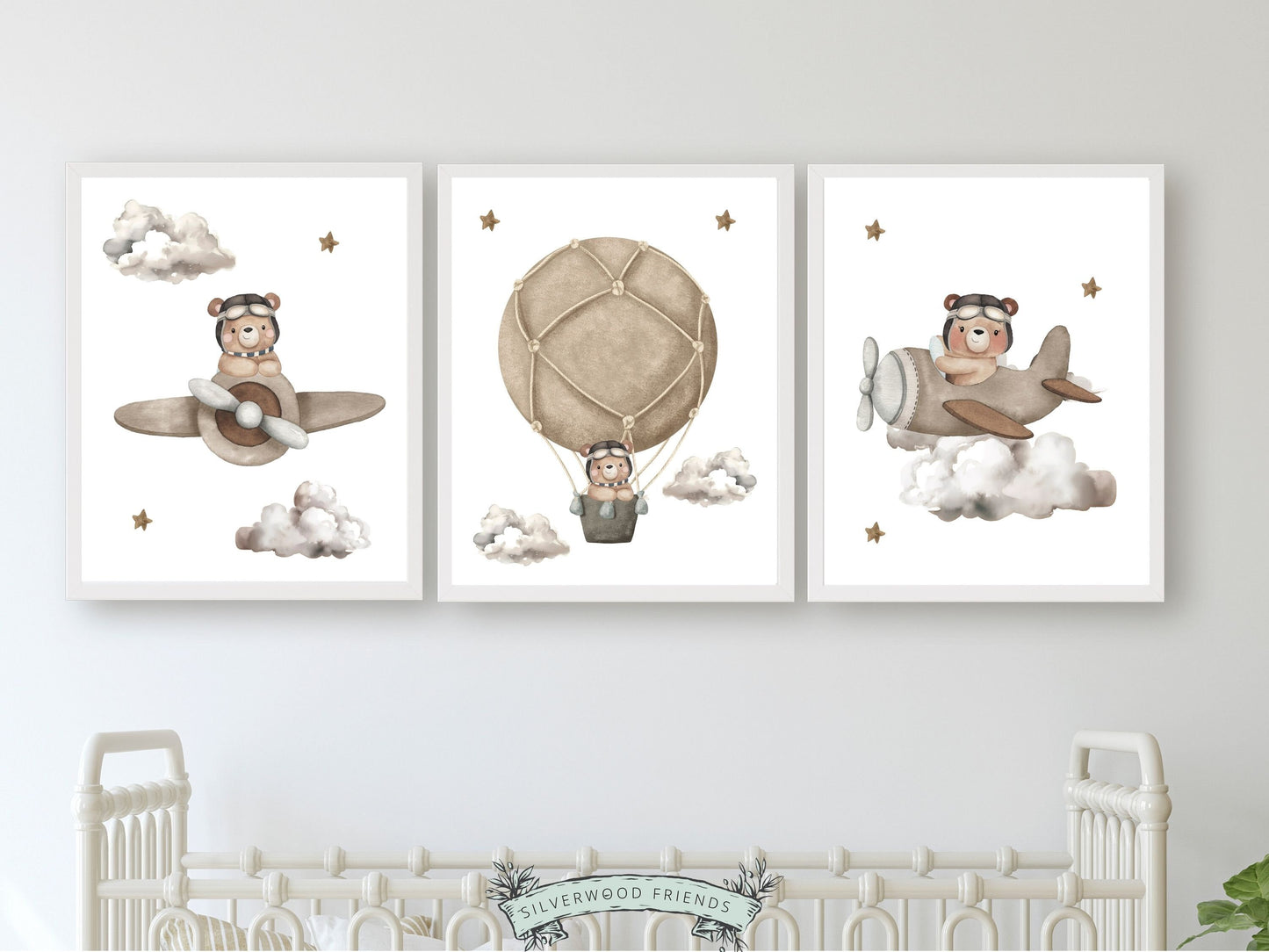 Set of 3 Beige Teddy Bear Nursery Prints features adorable teddy bears embarking on adventures amidst a dreamy star-studded sky, flying airplanes and a hot air balloon through fluffy clouds.