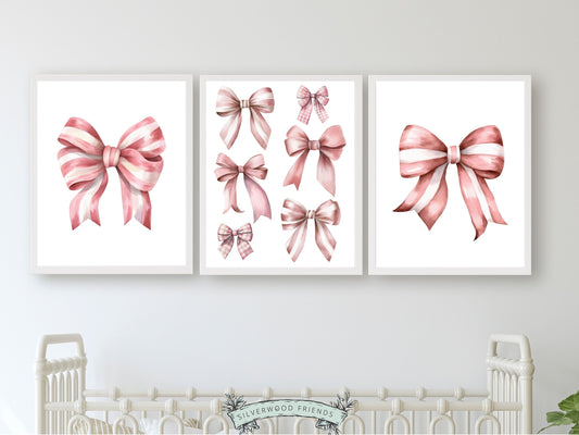 Set of 3 Pink Bow Prints, exuding a perfect blend of preppy charm and balletcore elegance. These delightful prints are a versatile addition to any room, whether you're styling a preppy dorm room or enhancing your baby girls' nursery decor. These prints make an ideal gift for a friend, a girls' baby shower, or even as a charming housewarming gesture.