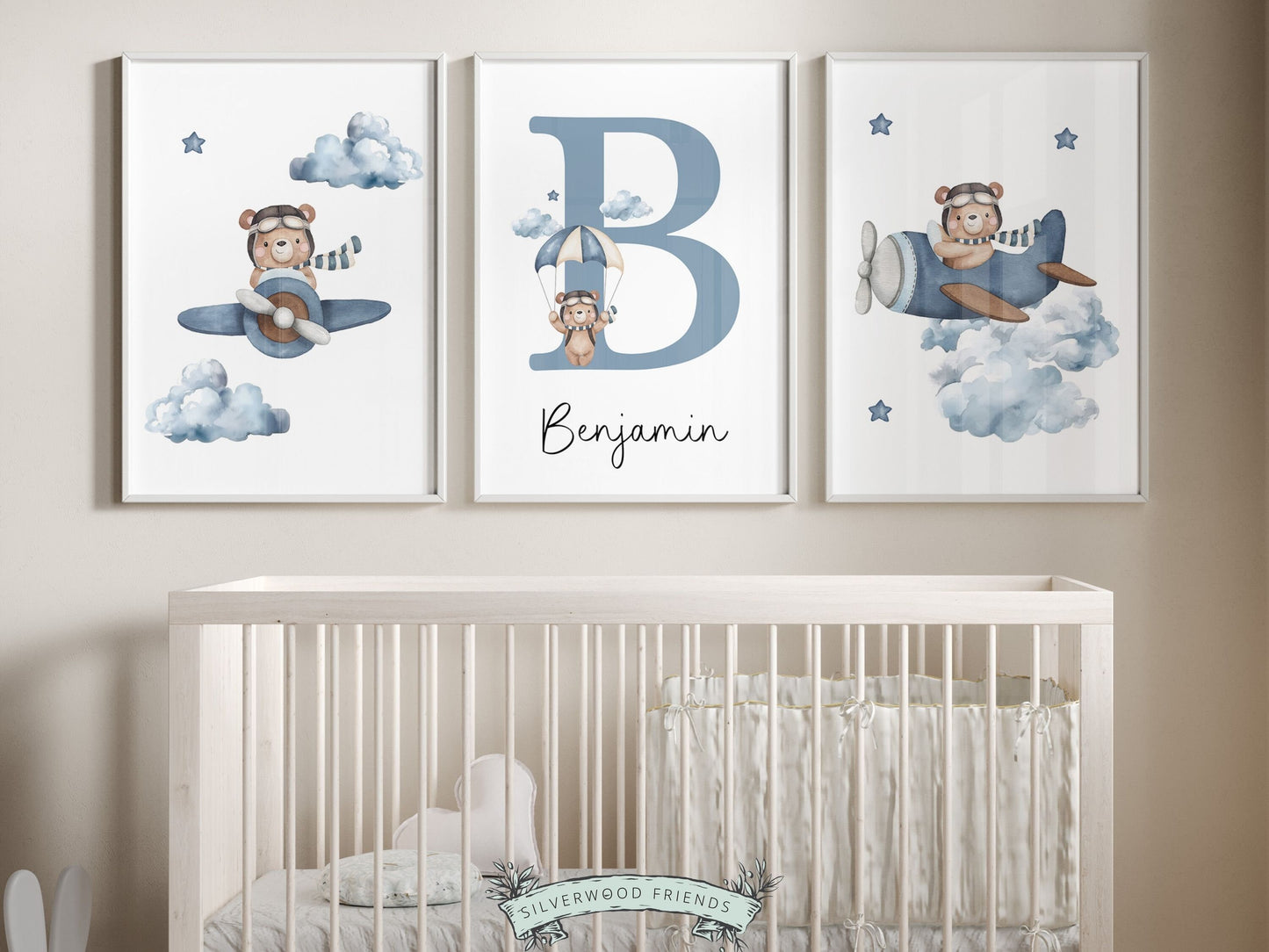 Teddy Bear Custom Name Nursery Prints, showcasing adorable watercolor teddy bears soaring through the sky on airplanes and parachutes amidst a dreamy cloud and star studded sky. The perfect addition to your bear themed nursery or baby shower gift.