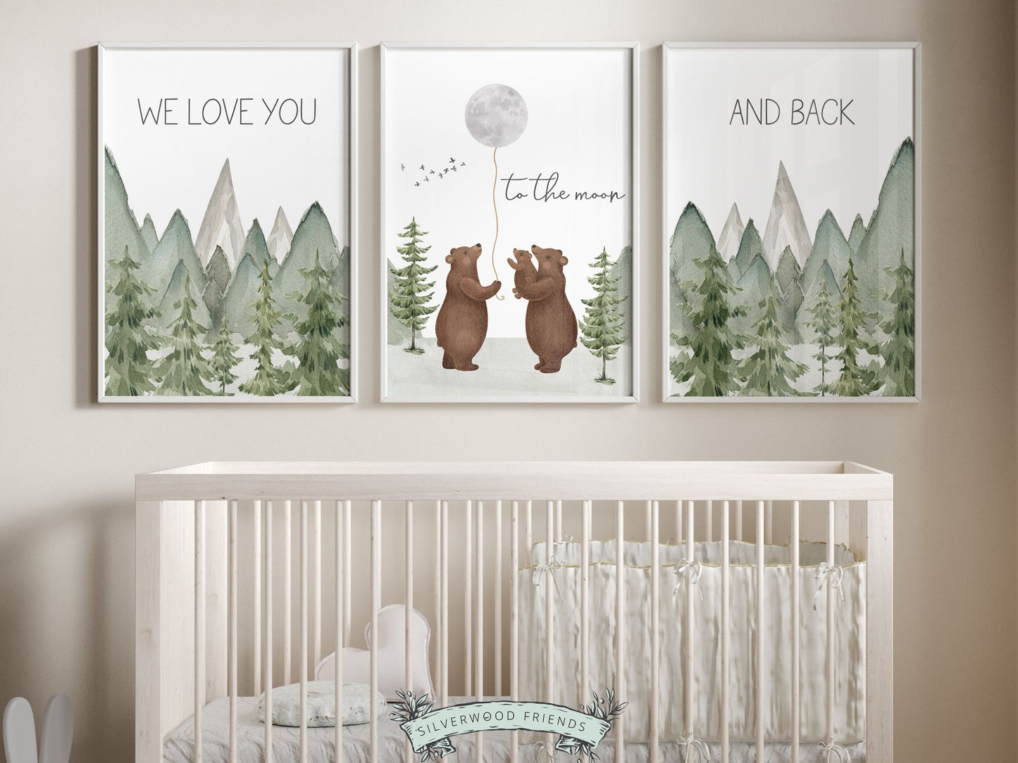 Set of 3 Bear Nursery Prints featuring a family of bears holding the moon and quote We love you to the moon and back and set against a watercolor mountain and woodland forest landscape. Ideal for your woodland nursery and as a baby shower gift