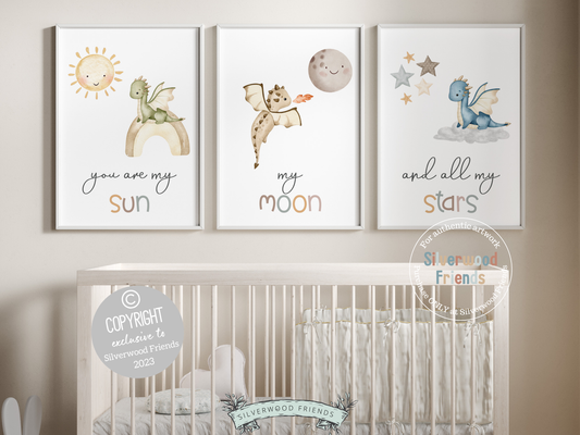 Transform your baby's nursery into a harmonious and dreamy sanctuary with this You Are My Sun Dragon Nursery Prints featuring baby dragons, a sun, moon, stars, and the loving quote "You are my sun, my moon, and all my stars." Perfect for your dragon nursery decor and as a baby shower gift.