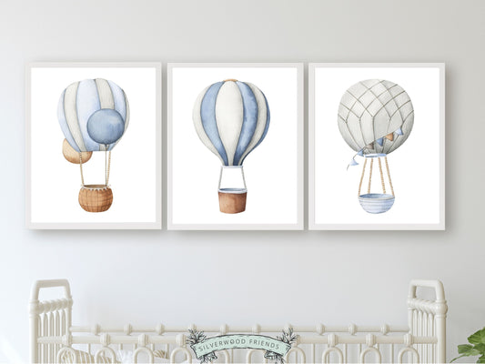 Transform your nursery into a serene haven with our charming Hot Air Balloon Nursery Prints, showcasing serene blue and grey watercolour hot air balloons. Perfect for your little ones transport themed nursery or as a delightful baby shower gift to cherish.