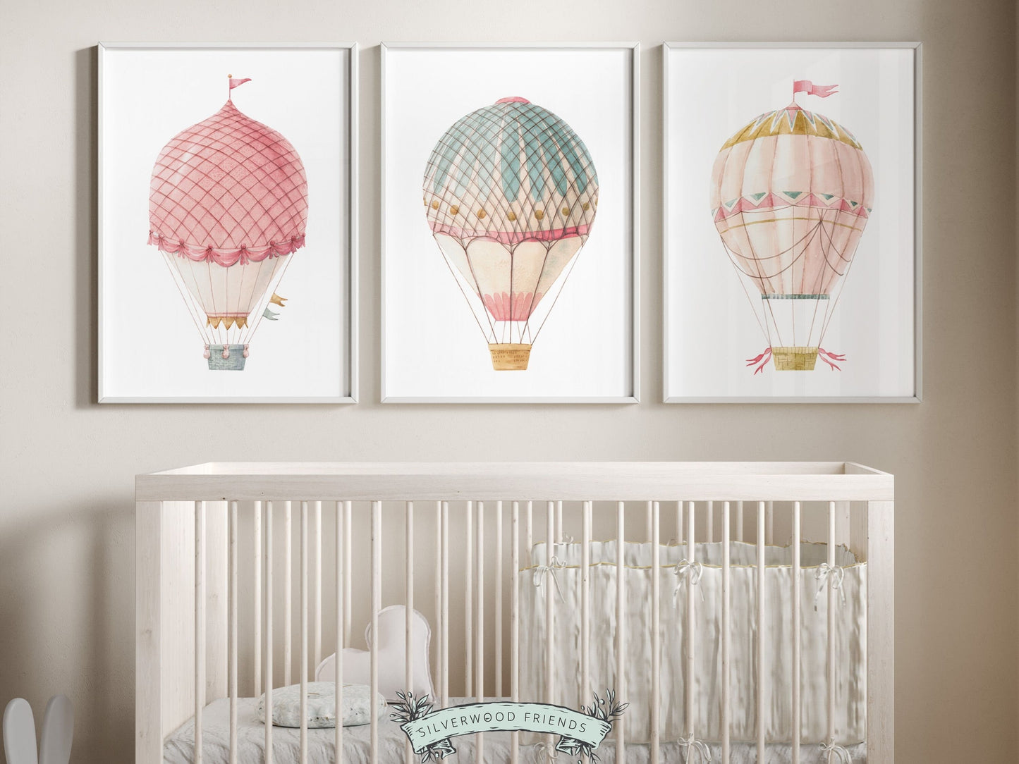 Set of 3 Watercolor Pink and Blue Candy Colored Hot Air Balloon Prints. Whether adorning a nursery or adding a pop of color to a dorm room, these vibrant prints are as playful as they are versatile and make a lovely baby shower gift or friends gift.