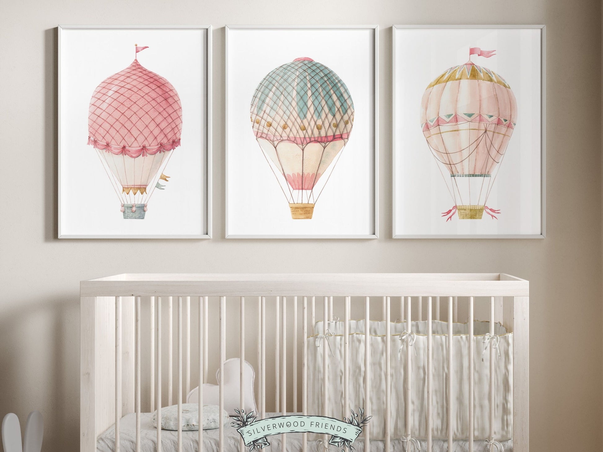 Set of 3 Watercolor Pink and Blue Candy Colored Hot Air Balloon Prints. Whether adorning a nursery or adding a pop of color to a dorm room, these vibrant prints are as playful as they are versatile and make a lovely baby shower gift or friends gift.
