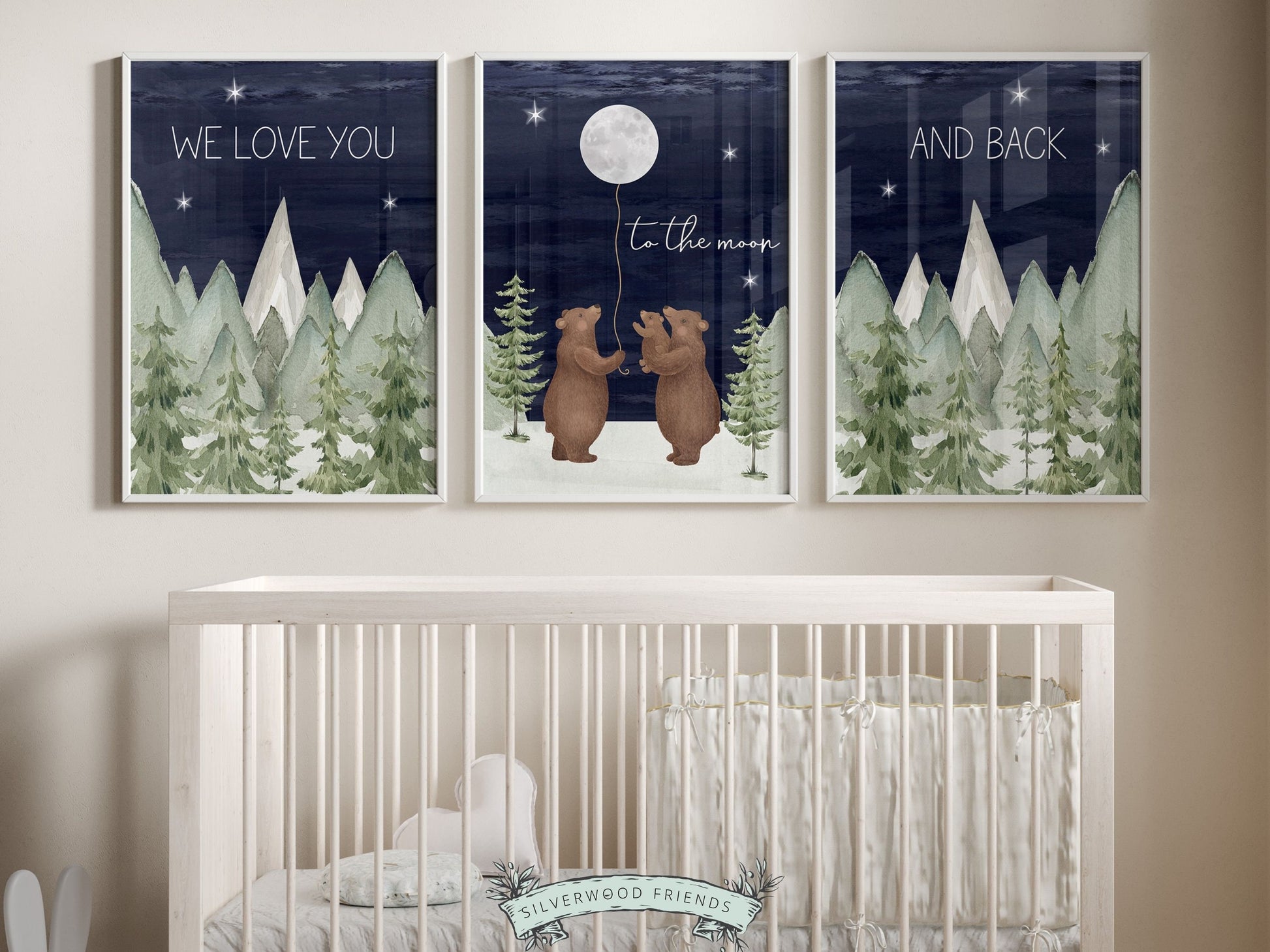 Set of 3 Bear Nursery Prints featuring a family of bears holding the moon under a starry night sky surrounded by mountain and woodland forest landscape and quote We love you to the moon and back. For your woodland nursery and as a baby shower gift.