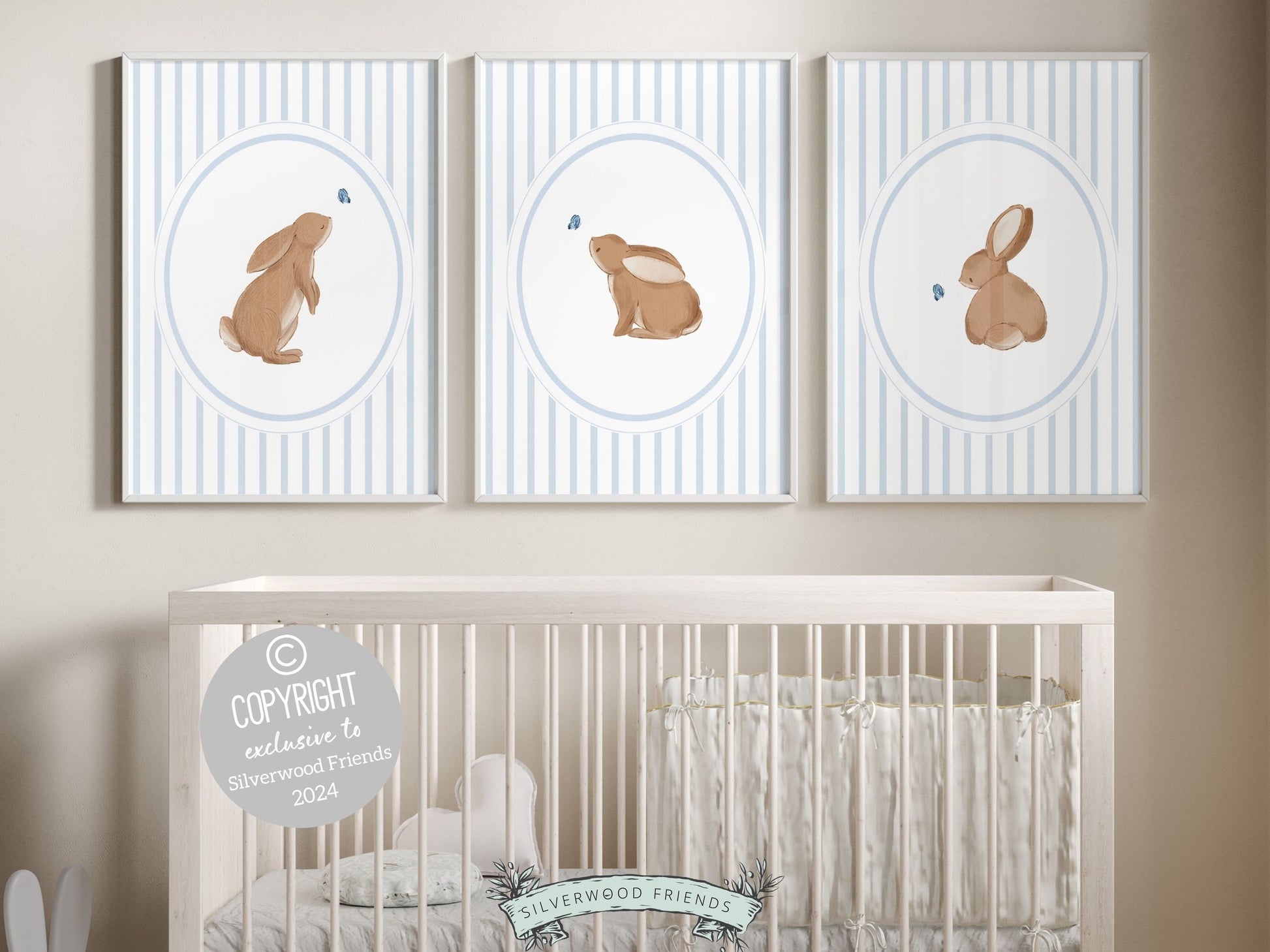 Our gorgeous Bunny Nursery Print Set of 3, showcasing adorable bunny rabbits and blue butterflies with baby blue chinoiserie wallpaper pattern, is perfect for your woodland nursery decor and makes a unique baby shower gift for both boys and girls.
