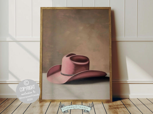 Cowgirl Hat Print, showcasing a watercolor cowgirl hat in soft pink and beige hues. This lovely digital print blends rustic appeal into your cowgirl themed decor, ideal for a cowgirl nursery or as a heartfelt gift for horse riding enthusiasts.