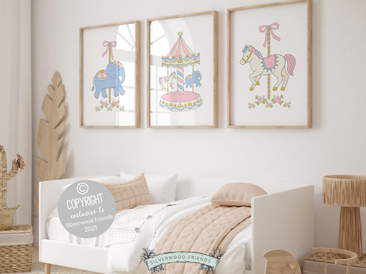 Carousel prints featuring delicate pastel pink and blue tones with beautifully detailed carousel horses and elephants. Perfect for adding a touch of whimsy to your baby girls nursery decor or as a unique and thoughtful baby shower gift!