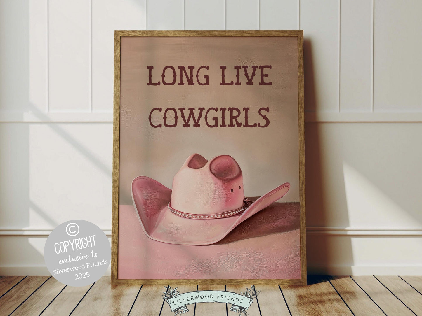 Cowgirl Hat Print, featuring a soft pink and beige watercolor hat alongside the quote Long Live Cowgirls. Perfect for country themed decor, this stylish artwork makes a lovely addition to a nursery, teen room, or any cowgirl inspired space!