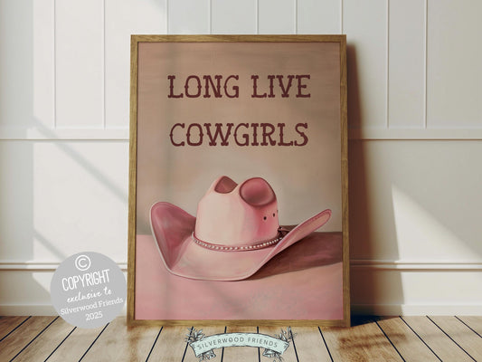 Cowgirl Hat Print, featuring a soft pink and beige watercolor hat alongside the quote Long Live Cowgirls. Perfect for country themed decor, this stylish artwork makes a lovely addition to a nursery, teen room, or any cowgirl inspired space!