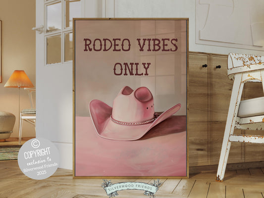 Cowgirl Hat Print, featuring a soft pink and beige watercolor hat alongside the quote Rodeo Vibes Only. Perfect for country themed decor, this stylish artwork makes a lovely addition to a nursery, teen room, or any cowgirl inspired space!