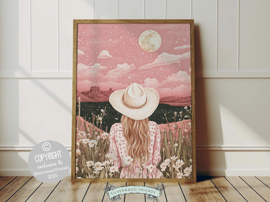 owgirl print, featuring a lone cowgirl gazing across the desert beneath a full moon and star studded sky. Designed in rich black and pink tones, this artwork is perfect for a southwestern nursery, dorm room, or as a gift for any cowgirl at heart!