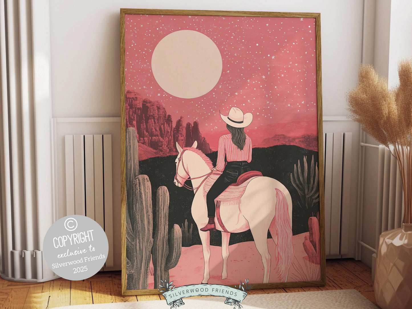 Cowgirl print, featuring a lone cowgirl on her horse gazing across the desert beneath a glowing full moon. Designed in rich black and pink tones, this artwork is perfect for a southwestern nursery, dorm room, or as a gift for any cowgirl at heart!