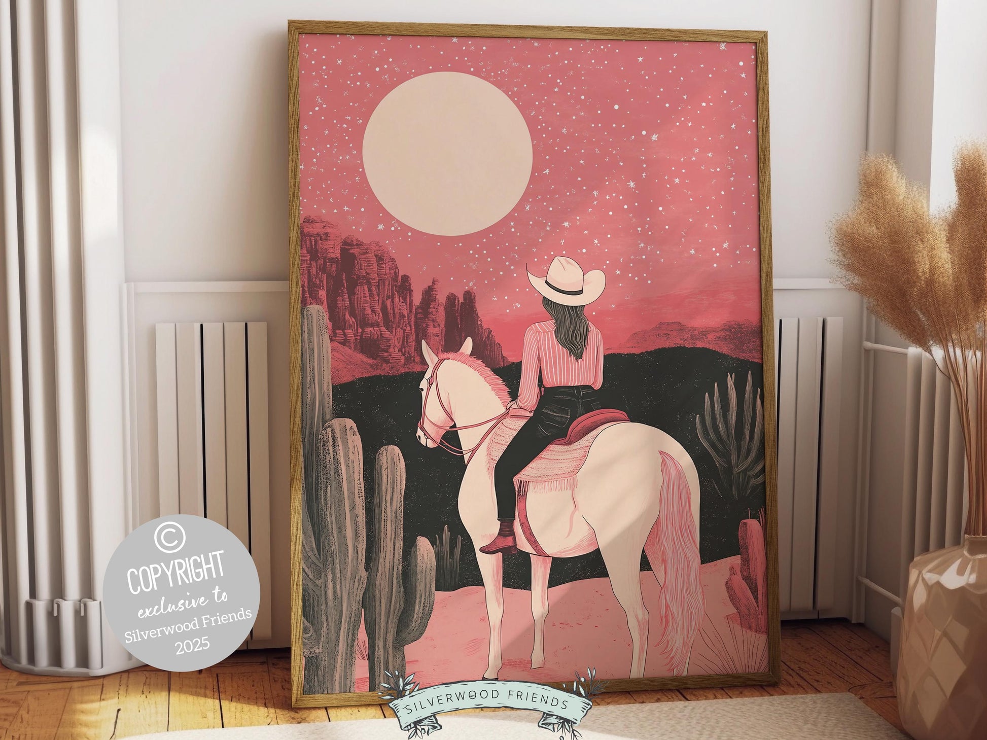 Cowgirl print, featuring a lone cowgirl on her horse gazing across the desert beneath a glowing full moon. Designed in rich black and pink tones, this artwork is perfect for a southwestern nursery, dorm room, or as a gift for any cowgirl at heart!
