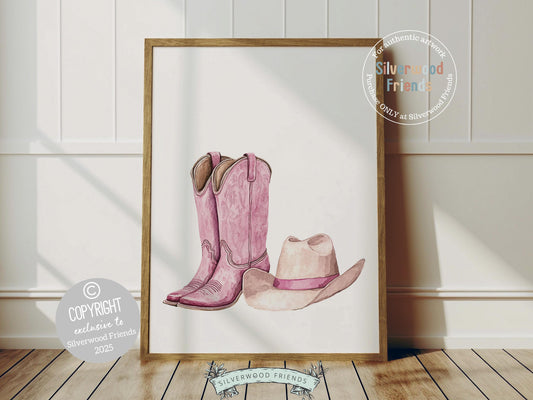 Infuse your decor with western flair using our Cowgirl Boots and Hat Print, showcasing watercolor cowgirl boots and a hat in soft pink and beige hues.
