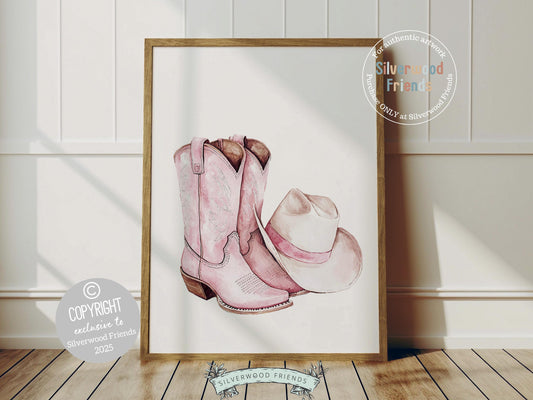 Infuse your decor with western flair using our Cowgirl Boots and Hat Print, showcasing watercolor cowgirl boots and a hat in soft pink and beige hues.