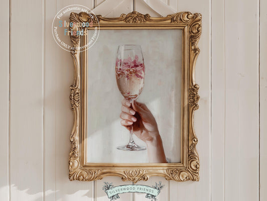 Celebrate in style with our Cheers Art Print, featuring a chic illustration of a girl&#39;s hand holding a champagne glass filled with vibrant flower petals. Perfect for social gathering spaces or trendy bar cart decor, this colorful artwork adds a fun, lively touch to your home.