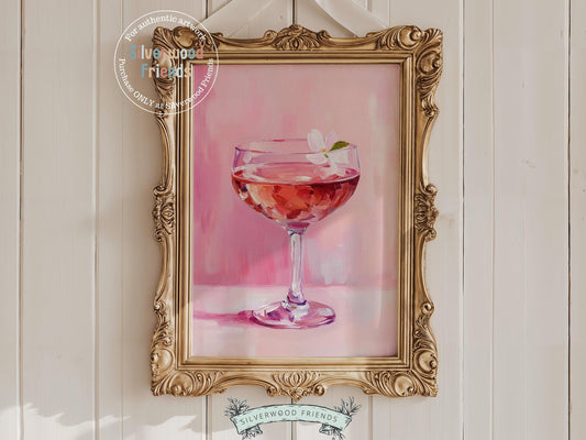 Raise a glass to all things pretty with our Cheers Art Print, showcasing a stylish champagne glass filled with delicate flower petal against a pink background. This flirty and feminine piece is the perfect addition to a girls&#39; night setup, glam bar cart, or any space that needs a touch of playful charm.