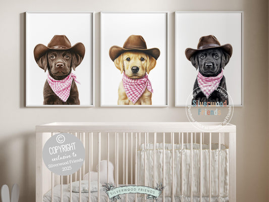 Total cuteness overload! Bring a touch of rustic charm to your baby girl&#39;s nursery with our Cowboy Nursery Prints, featuring sweet chocolate, yellow, and black Labrador puppies all decked out in cowboy hats and pink-and-white check bandanas. Perfect for dog-loving families, this playful western artwork adds warmth and makes a one-of-a-kind, thoughtful baby shower gift.