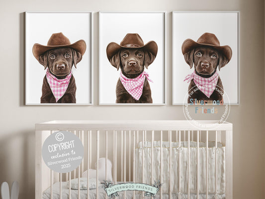 Aww! Cuteness overload! Add a touch of rustic charm to your baby&#39;s nursery with our Cowboy Nursery Prints, featuring adorable chocolate brown Labrador puppies dressed in cowboy hats and pink and white check bandanas. Perfect for dog-loving families, this heartwarming artwork brings a playful western vibe and makes a thoughtful baby shower gift.