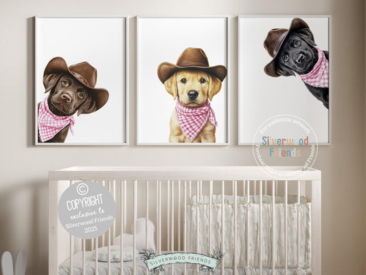 Cuteness overload! Add a touch of rustic charm to your baby girl&#39;s nursery with our Cowboy Nursery Prints, featuring adorable peeking chocolate, yellow, and black Labrador puppies in cowboy hats and pink-and-white checkered bandanas. Perfect for dog-loving families, this sweet western-inspired artwork brings playful personality and makes a thoughtful, one-of-a-kind baby shower gift.