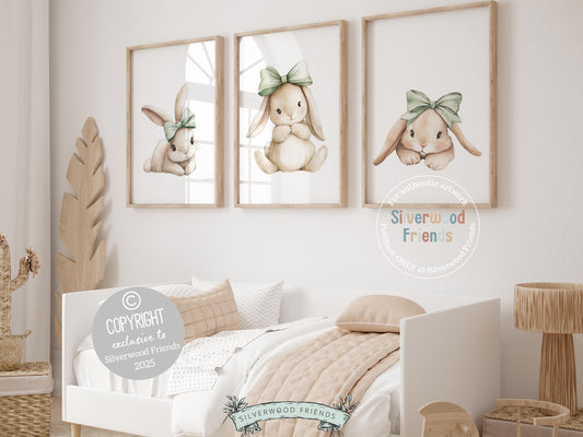 Our delightful minimalist Set of 3 Bunny Nursery Prints features adorable bunny rabbits in sage green bows. Perfect for your baby girl&#39;s woodland nursery decor and also makes a unique baby shower gift.