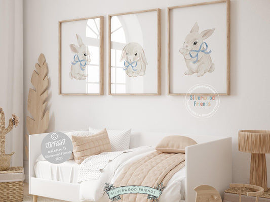 Our delightful minimalist Set of 3 Bunny Nursery Prints features adorable bunny rabbits in blue bows. Perfect for your baby&#39;s woodland nursery decor and also makes a unique baby shower gift.