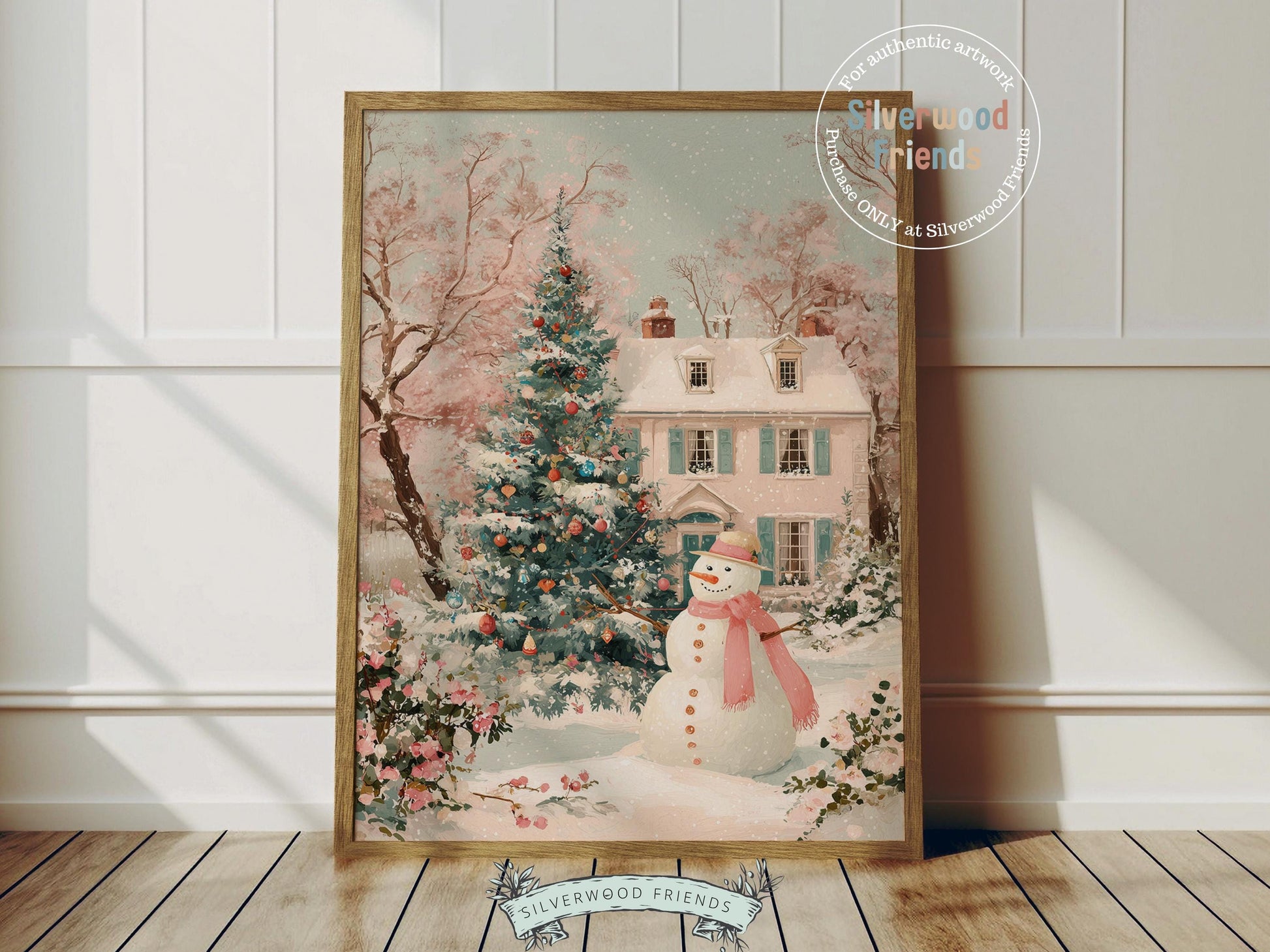 This delightful Christmas print features a cheerful snowman in a soft pink scarf standing before a pastel pink and green village house dusted with snow. With its gentle watercolor tones and whimsical charm, it brings a cozy, festive touch to any nursery or holiday home décor.