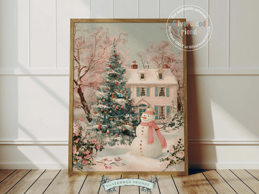 This delightful Christmas print features a cheerful snowman in a soft pink scarf standing before a pastel pink and green village house dusted with snow. With its gentle watercolor tones and whimsical charm, it brings a cozy, festive touch to any nursery or holiday home décor.