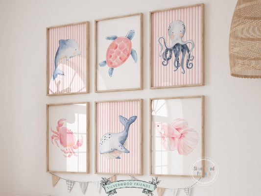 Our Sea Animal Nursery Print Set of 6, where enchantment meets the sea, features beautifully illustrated sea animals in pastel pink and blue colours. These prints are perfect for any ocean theme nursery and make a unique baby shower gift.