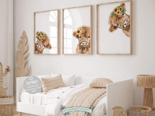 Our Peeking Highland Cow Nursery Prints features adorable watercolor peeking baby highland cows with sunflower crowns set on a white background.