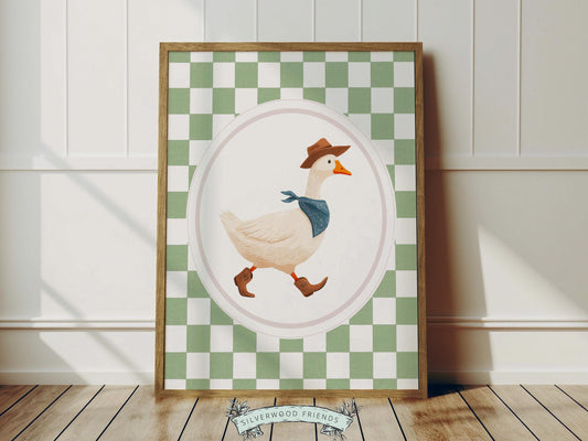 Add a playful western touch to your little one’s room with this charming Goose Cowboy Nursery Print. Framed with a soft sage green checkered border, this whimsical print is perfect for cowboy nurseries, western-themed baby rooms, or as a unique baby shower gift that will be treasured for years to come.