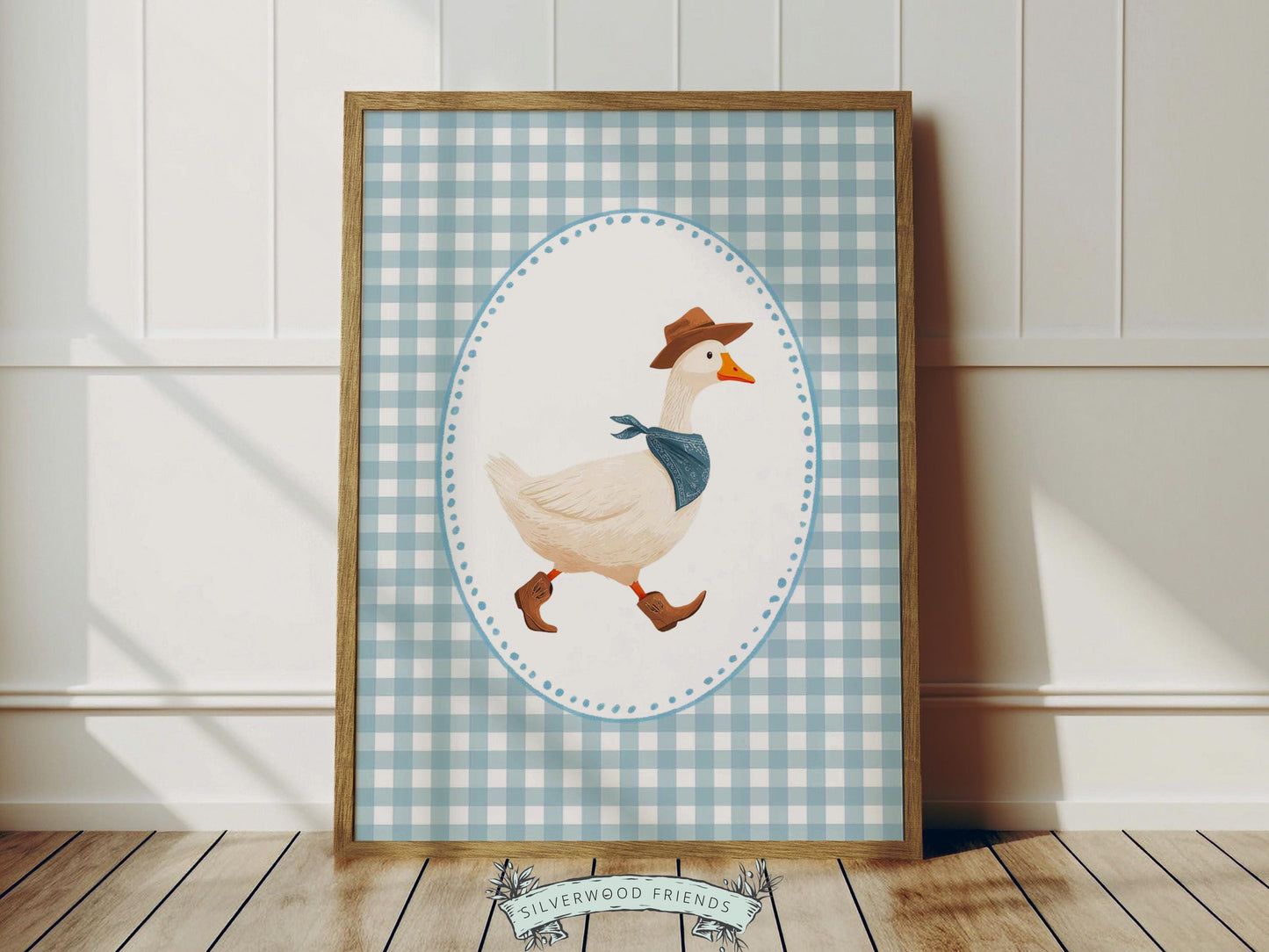 Add a playful western touch to your little one’s room with this charming Goose Cowboy Nursery Print. Framed with a soft blue and white checkered border, this whimsical print is perfect for cowboy nurseries, western-themed baby rooms, or as a unique baby shower gift that will be treasured for years to come.