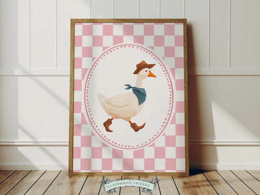Add a playful western touch to your little one’s room with this charming Goose Cowboy Nursery Print. Framed with a soft pink and white checkered border, this whimsical print is perfect for cowgirl nurseries, western-themed baby rooms, or as a unique baby shower gift that will be treasured for years to come. 🤠🪿