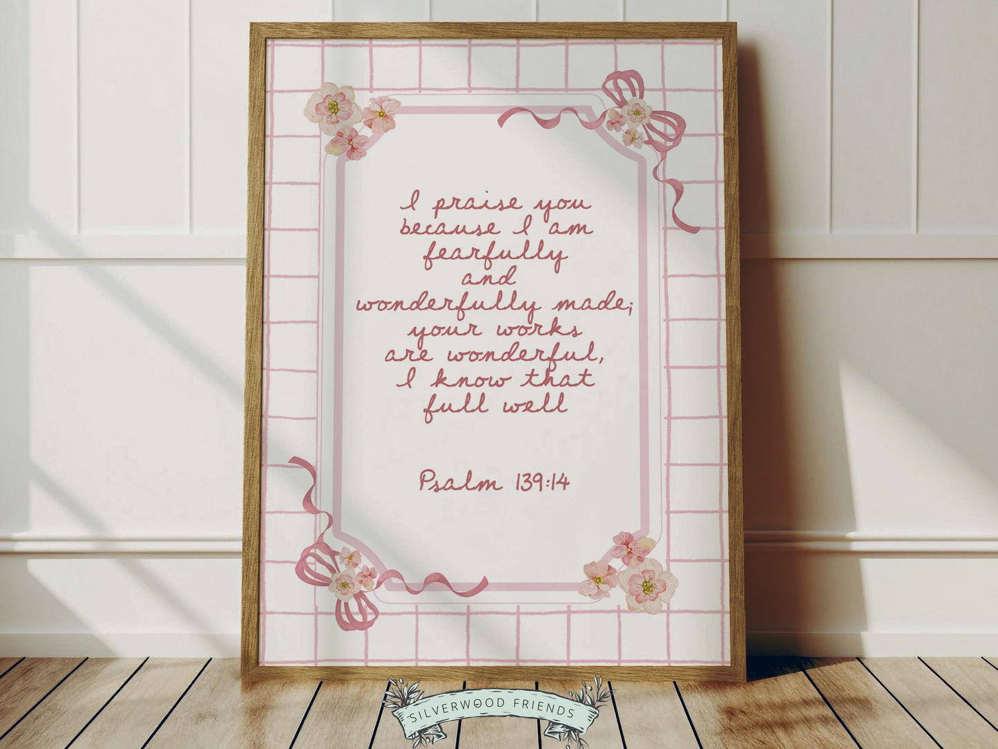Create a peaceful and faith-filled space with this Psalm 139:14 nursery wall art, featuring the beloved “Fearfully and Wonderfully Made” Bible verse in soft pink lettering set against a pink and white striped background, accented with sweet pink bows and delicate pink and yellow watercolor wildflowers.