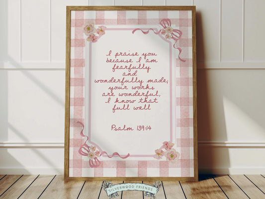 Create a peaceful and faith-filled space with this Psalm 139:14 nursery wall art, featuring the beloved “Fearfully and Wonderfully Made” Bible verse in soft pink lettering set against a charming pink and white gingham check background, adorned with delicate bows and soft pink and yellow watercolor wildflowers. This beautiful Christian nursery print is a meaningful reminder that every child is wonderfully made and deeply loved by God.