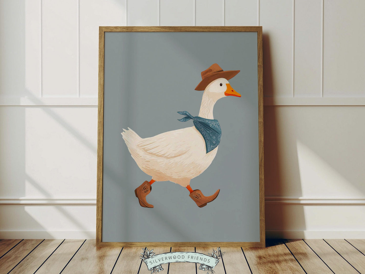Add a playful western touch to your little one’s room with this charming Goose Cowboy Nursery Print. Framed with a soft dusty blue border, this whimsical print is perfect for cowboy nurseries, western-themed baby rooms, or as a unique baby shower gift that will be treasured for years to come. 🤠🪿