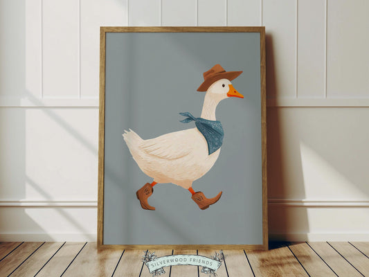 Add a playful western touch to your little one’s room with this charming Goose Cowboy Nursery Print. Framed with a soft dusty blue border, this whimsical print is perfect for cowboy nurseries, western-themed baby rooms, or as a unique baby shower gift that will be treasured for years to come. 🤠🪿