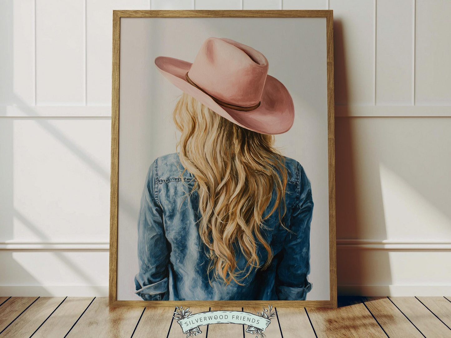 Create a calm and beautiful space with this western cowgirl wall art print, featuring a softly styled portrait of a blonde cowgirl in a pink cowgirl hat, illustrated in a dreamy oil painting style with visible brushstroke texture and warm, rustic tones. This timeless artwork has a rich, canvas-like finish that adds depth, softness, and a charming farmhouse feel to any room.