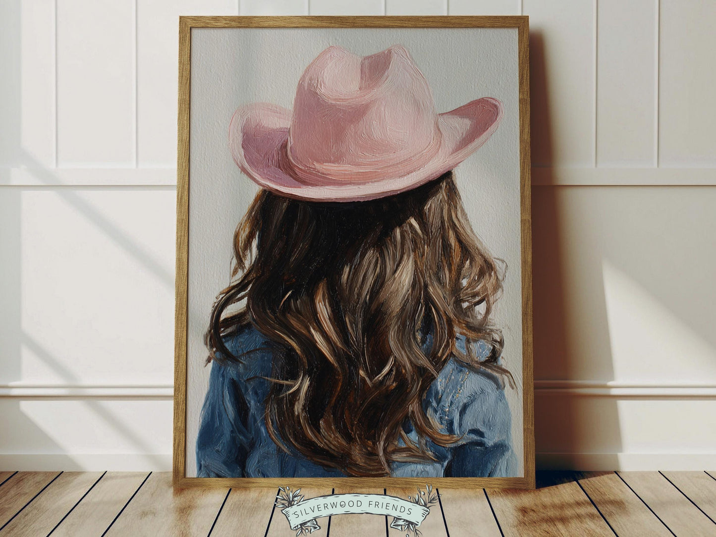 Create a calm and beautiful space with this western cowgirl wall art print, featuring a softly styled portrait of a young brown-haired cowgirl in a pink cowgirl hat, illustrated in a dreamy oil painting style with visible brushstroke texture and warm, rustic tones. This timeless artwork has a rich, canvas-like finish that adds depth, softness, and a charming farmhouse feel to any room.