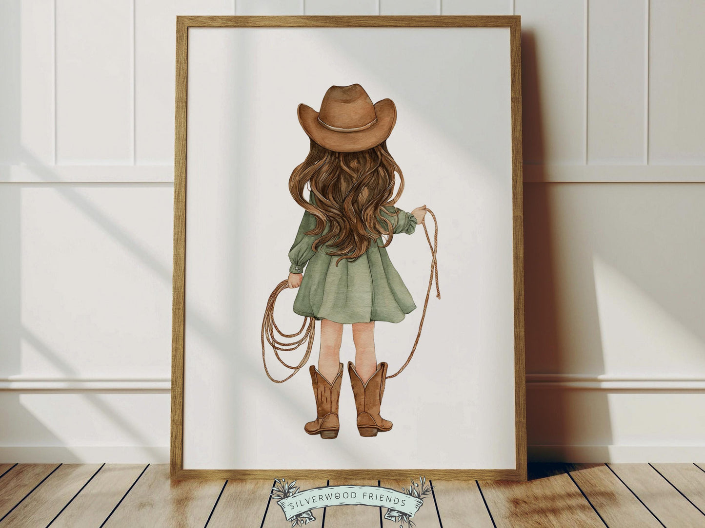 Create a warm and whimsical space with this western cowgirl nursery wall art print, featuring a beautifully illustrated watercolor cowgirl from behind holding a rope, dressed in a soft sage green dress with classic cowboy boots and hat. Designed in gentle, earthy tones with a charming storybook feel, this western nursery print adds a cozy farmhouse touch to any baby girl nursery, bedroom, or playroom, making it a timeless and stylish decor piece.