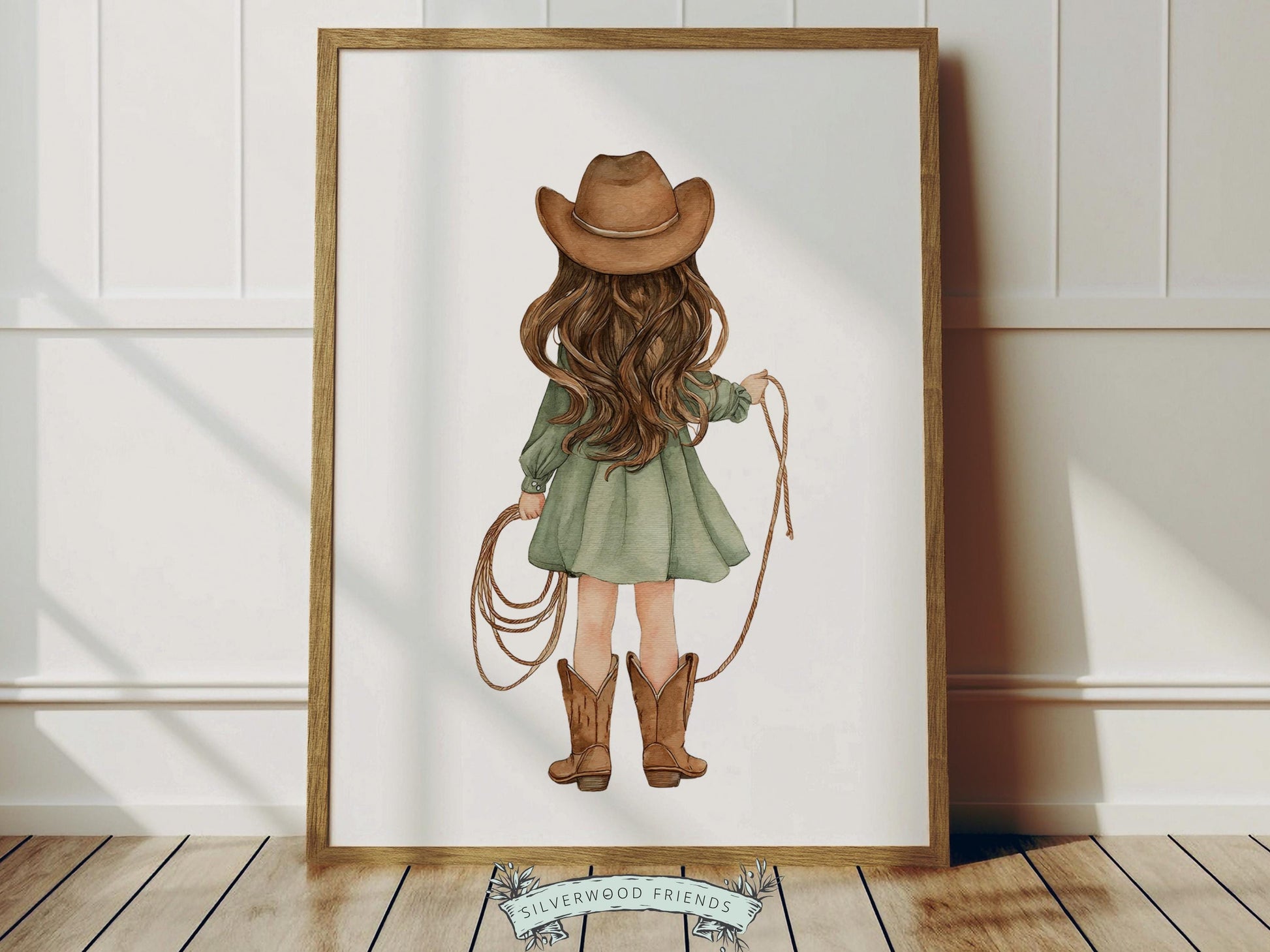 Create a warm and whimsical space with this western cowgirl nursery wall art print, featuring a beautifully illustrated watercolor cowgirl from behind holding a rope, dressed in a soft sage green dress with classic cowboy boots and hat. Designed in gentle, earthy tones with a charming storybook feel, this western nursery print adds a cozy farmhouse touch to any baby girl nursery, bedroom, or playroom, making it a timeless and stylish decor piece.