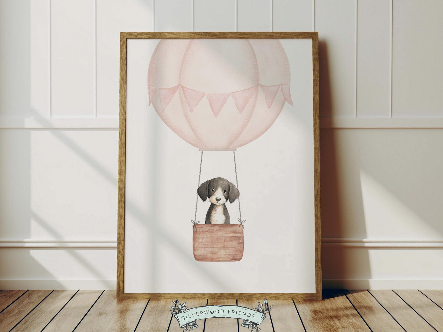 Let their imagination soar with this watercolor hot air balloon nursery print, featuring an adorable puppy dog gently floating through the sky in a soft pink balloon with delicate bunting details. Designed in a dreamy, storybook style with soft neutral tones, this charming artwork adds a sweet and whimsical touch to any baby girl nursery, bedroom, or playroom, and makes a beautiful baby shower gift.